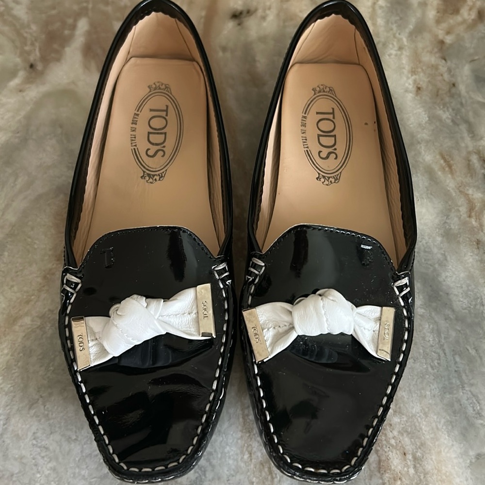 Tod's Black and White Loafers with Metallic Bow